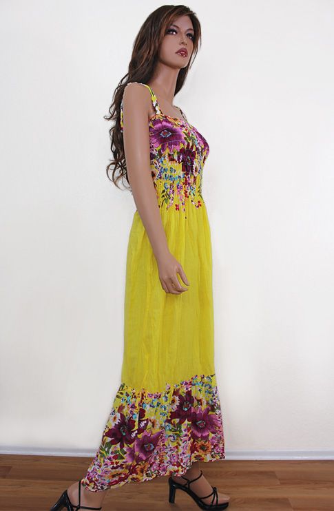 Colorful maxi sundress that features smocked bust line, elastic 